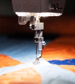 Discover the joy of quilting with Grace Company Qnique 21X Elite