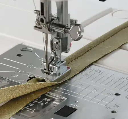 Janome Piping Foot 9mm for creating professional-looking piping on fabrics and garments